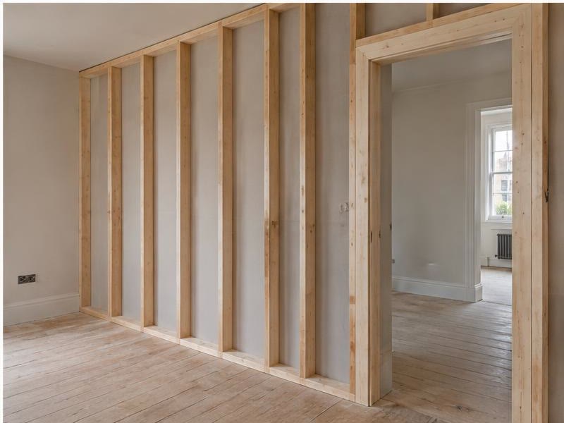 Timber stud partition wall under construction